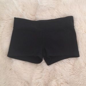 Black Ivivva shorts.